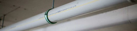 installation of a sewage plastic pipe during the construction of a house. Creative Banner. Copyspace image