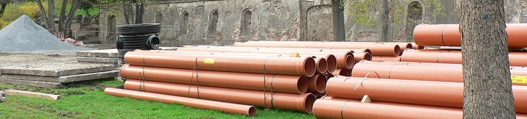 installation of a sewage plastic pipe during the construction of a house. Creative Banner. Copyspace image