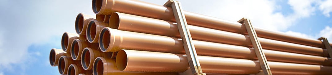 installation of a sewage plastic pipe during the construction of a house. Creative Banner. Copyspace image