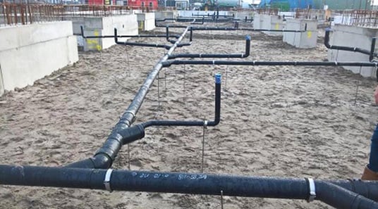 installation of a sewage plastic pipe during the construction of a house. Creative Banner. Copyspace image