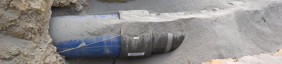 installation of a sewage plastic pipe during the construction of a house. Creative Banner. Copyspace image