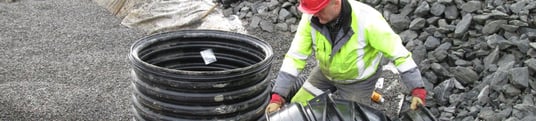 installation of a sewage plastic pipe during the construction of a house. Creative Banner. Copyspace image