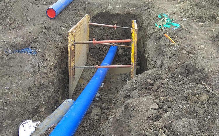 installation of a sewage plastic pipe during the construction of a house. Creative Banner. Copyspace image