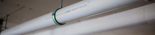 installation of a sewage plastic pipe during the construction of a house. Creative Banner. Copyspace image