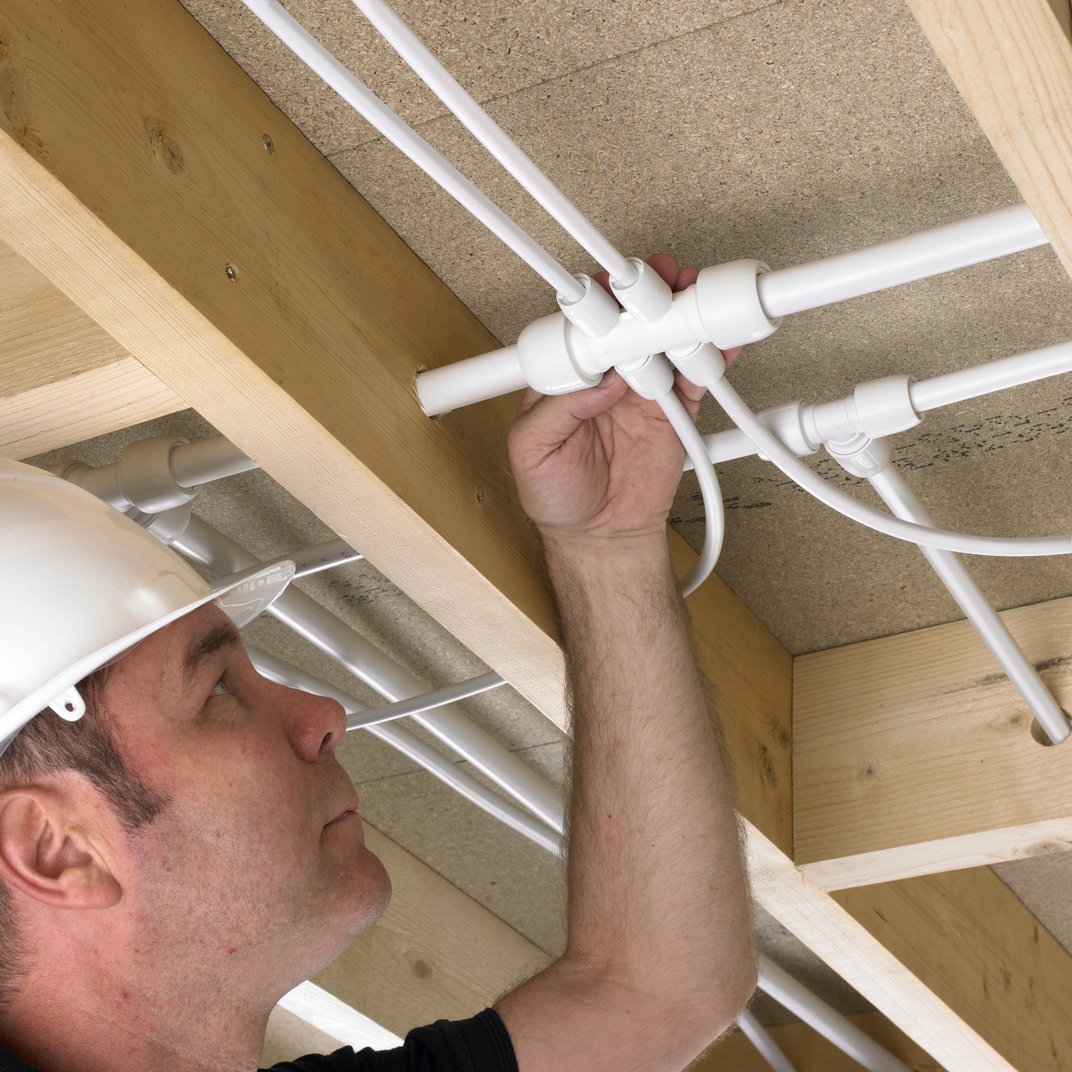installation of a sewage plastic pipe during the construction of a house. Creative Banner. Copyspace image
