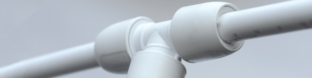 installation of a sewage plastic pipe during the construction of a house. Creative Banner. Copyspace image