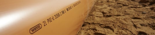 installation of a sewage plastic pipe during the construction of a house. Creative Banner. Copyspace image