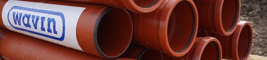 installation of a sewage plastic pipe during the construction of a house. Creative Banner. Copyspace image