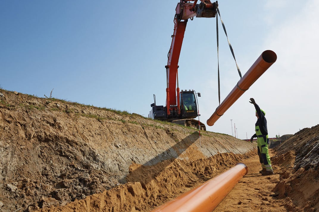 installation of a sewage plastic pipe during the construction of a house. Creative Banner. Copyspace image