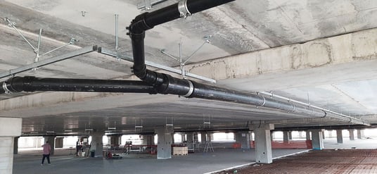installation of a sewage plastic pipe during the construction of a house. Creative Banner. Copyspace image