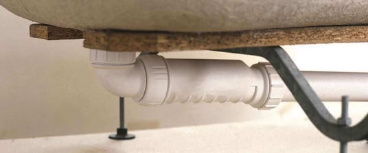installation of a sewage plastic pipe during the construction of a house. Creative Banner. Copyspace image