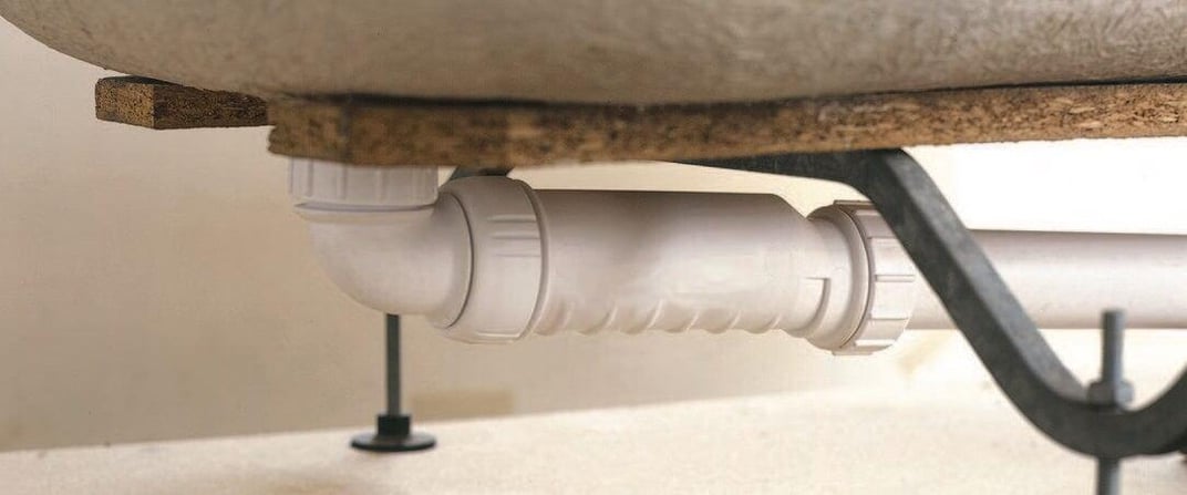 installation of a sewage plastic pipe during the construction of a house. Creative Banner. Copyspace image