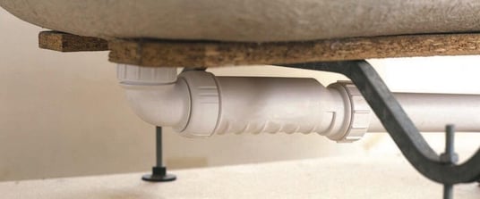 installation of a sewage plastic pipe during the construction of a house. Creative Banner. Copyspace image