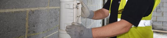 installation of a sewage plastic pipe during the construction of a house. Creative Banner. Copyspace image