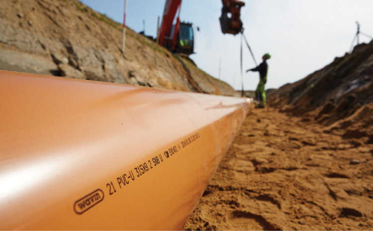 installation of a sewage plastic pipe during the construction of a house. Creative Banner. Copyspace image
