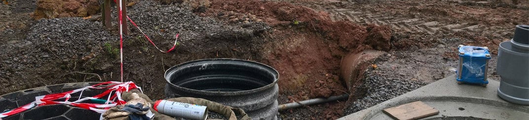 installation of a sewage plastic pipe during the construction of a house. Creative Banner. Copyspace image