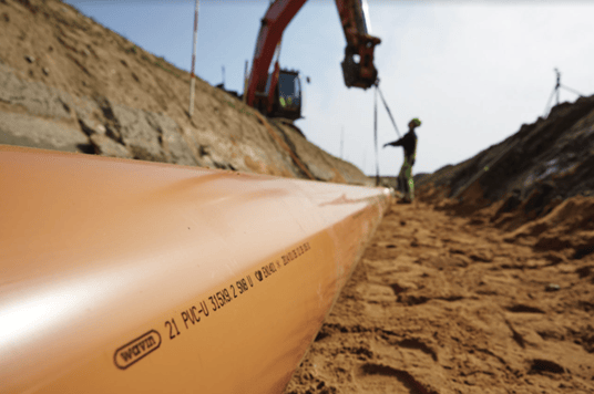 installation of a sewage plastic pipe during the construction of a house. Creative Banner. Copyspace image