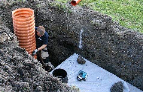 installation of a sewage plastic pipe during the construction of a house. Creative Banner. Copyspace image