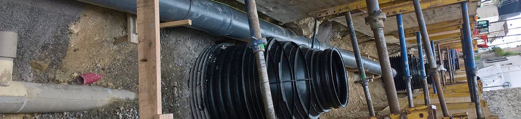 installation of a sewage plastic pipe during the construction of a house. Creative Banner. Copyspace image