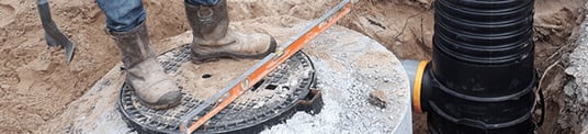 installation of a sewage plastic pipe during the construction of a house. Creative Banner. Copyspace image
