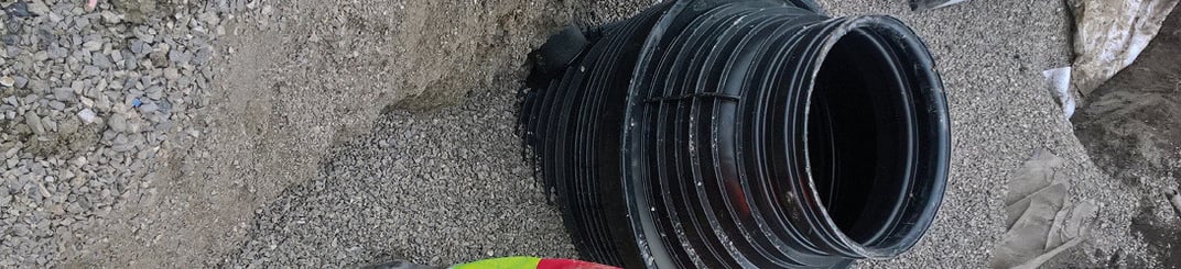 installation of a sewage plastic pipe during the construction of a house. Creative Banner. Copyspace image