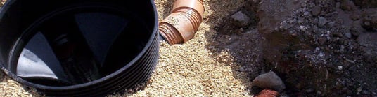 installation of a sewage plastic pipe during the construction of a house. Creative Banner. Copyspace image