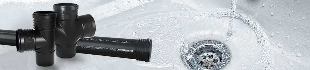 installation of a sewage plastic pipe during the construction of a house. Creative Banner. Copyspace image