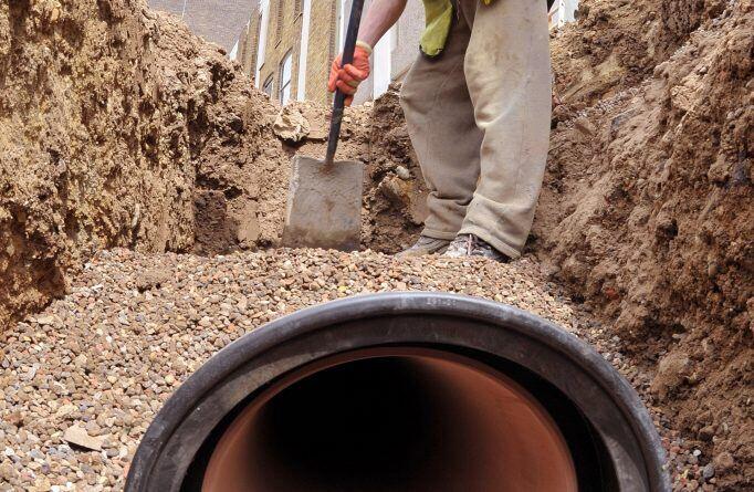 installation of a sewage plastic pipe during the construction of a house. Creative Banner. Copyspace image