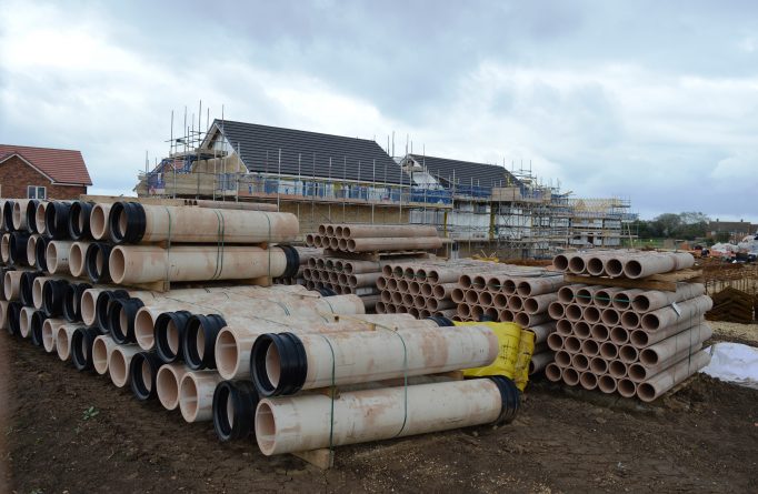stacked Hepworth clay pipes at construction site