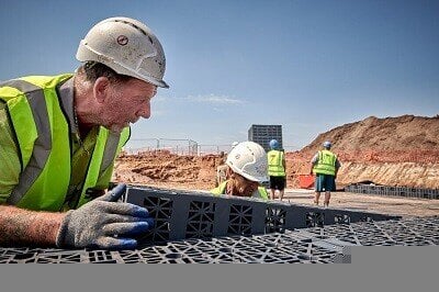 Construction worker installing aquacell