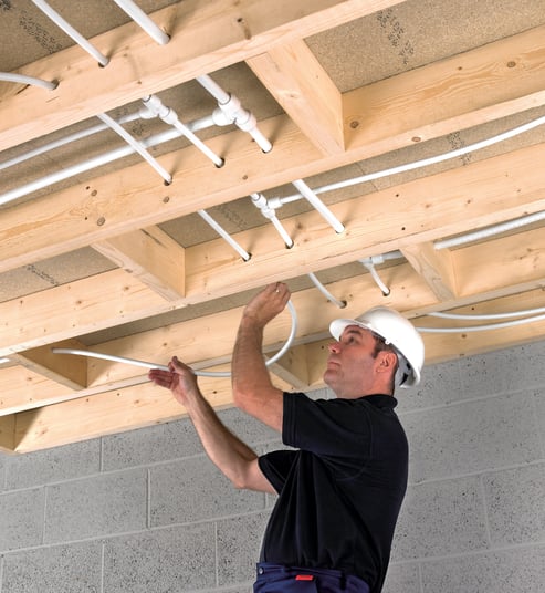 installation of a sewage plastic pipe during the construction of a house. Creative Banner. Copyspace image