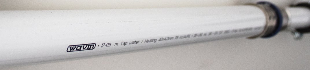 installation of a sewage plastic pipe during the construction of a house. Creative Banner. Copyspace image