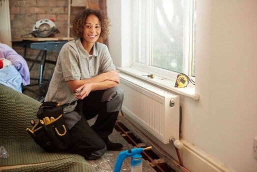 woman-plumber-sitting-down