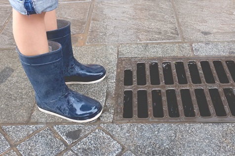 Wellies next to drain